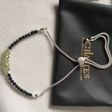 Load image into Gallery viewer, Grossular Garnet Black Spinel Slider